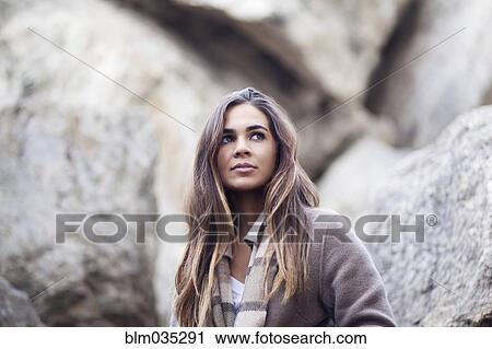 Mixed race woman near rocks View Large Photo Image Stock Image - Mixed race woman near rocks. Fotosearch