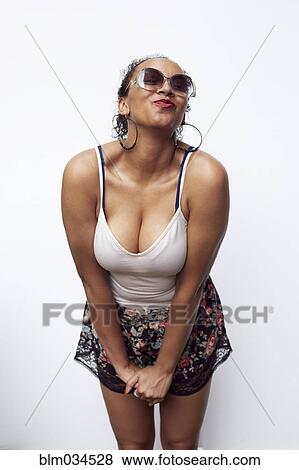 Mixed race woman posing and making kissy face View Large Photo Image Stock Photo - Mixed race woman posing and making kissy face. Fotosearch