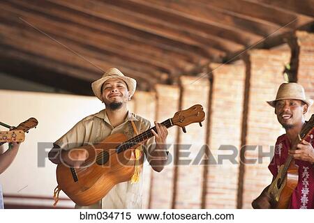 Stock Photography - Musicians performing in courtyard. Fotosearch