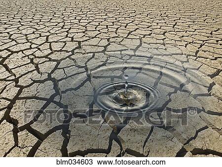 Ripple of water in cracked desert earth View Large Photo Image Stock Image - Ripple of water in cracked desert earth. Fotosearch