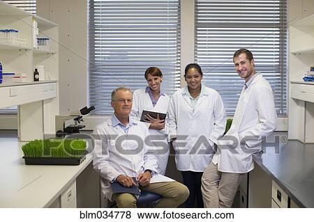Stock Photo - Scientists smiling in laboratory. Fotosearch