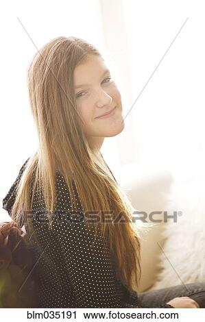 Stock Image - Smiling Caucasian girl with long hair. Fotosearch