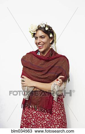 Stock Image - Stylish woman wearing shawl and flowers in hair. Fotosearch