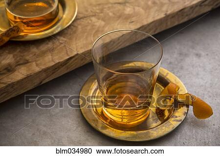 Stock Image - Variety of cocktails on gold platters. Fotosearch