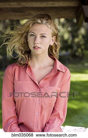 Woman sitting outdoors View Large Photo Image Stock Photo - Woman sitting outdoors. Fotosearch