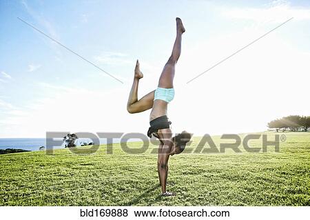 African American woman practicing yoga in park View Large Photo Image Stock Photo - African American woman practicing yoga in park. Fotosearch