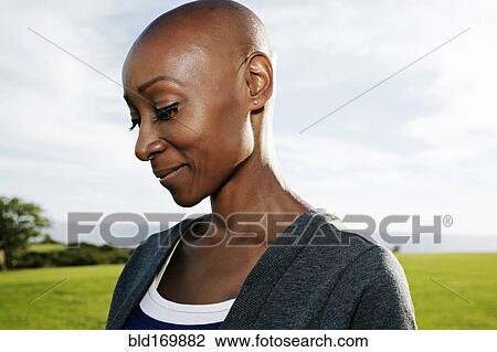 African American woman smiling in park View Large Photo Image Stock Image - African American woman smiling in park. Fotosearch