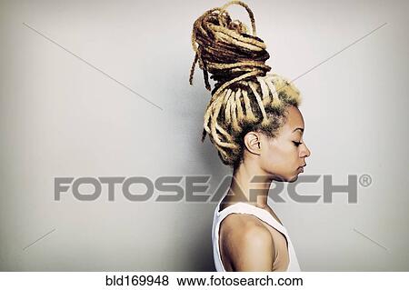 Stock Photo - Black woman with dreadlocks bun. Fotosearch