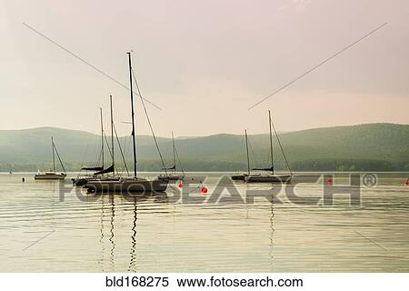 Boats floating in harbor View Large Photo Image Stock Photography - Boats floating in harbor. Fotosearch
