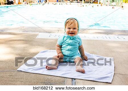 Caucasian baby girl sitting near swimming pool View Large Photo Image Stock Image - Caucasian baby girl sitting near swimming pool. Fotosearch