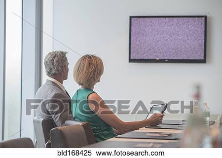 Stock Photography - Caucasian business people in videoconference meeting. Fotosearch