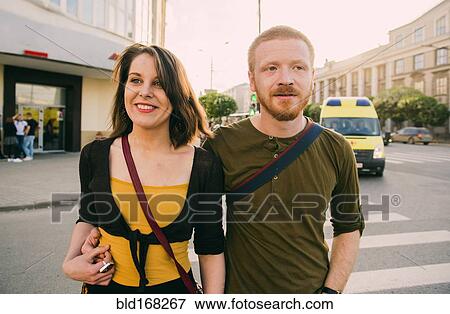 Caucasian couple crossing city intersection View Large Photo Image Stock Photo - Caucasian couple crossing city intersection. Fotosearch