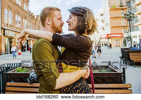 Caucasian couple hugging in city View Large Photo Image Stock Image - Caucasian couple hugging in city. Fotosearch