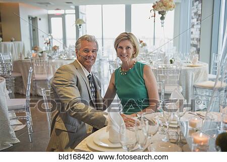 Caucasian couple smiling in empty restaurant View Large Photo Image Stock Image - Caucasian couple smiling in empty restaurant. Fotosearch