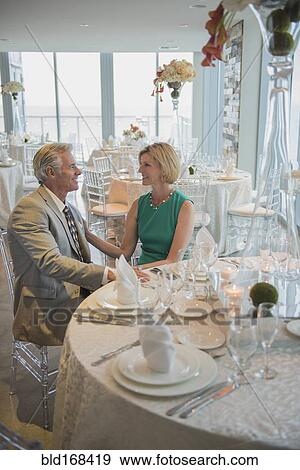 Caucasian couple talking in empty restaurant View Large Photo Image Stock Photo - Caucasian couple talking in empty restaurant. Fotosearch