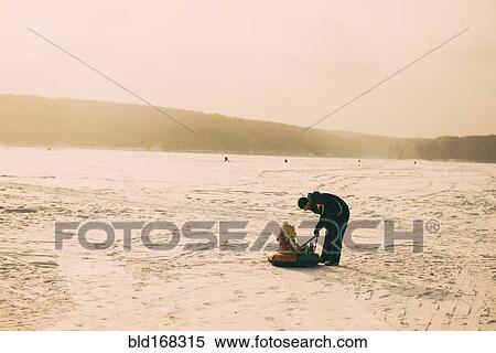 Caucasian father and daughter playing in snowy field View Large Photo Image Stock Photography - Caucasian father and daughter playing in snowy field. Fotosearch