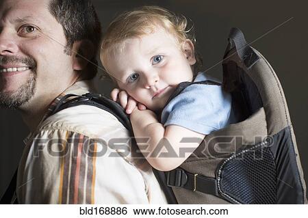 Caucasian father carrying son on back View Large Photo Image Stock Photograph - Caucasian father carrying son on back. Fotosearch