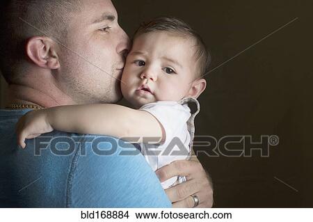 Caucasian father kissing son View Large Photo Image Picture - Caucasian father kissing son. Fotosearch