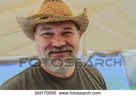 Caucasian man wearing cowboy hat View Large Photo Image Stock Image - Caucasian man wearing cowboy hat. Fotosearch