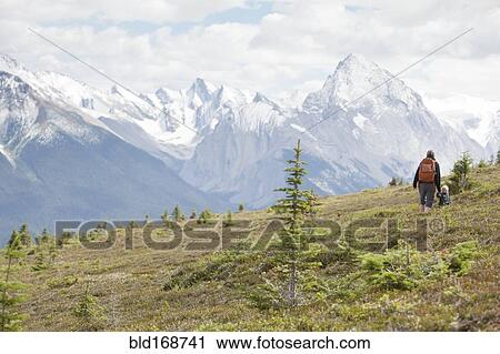 Caucasian mother and son hiking on remote hillside View Large Photo Image Stock Image - Caucasian mother and son hiking on remote hillside. Fotosearch