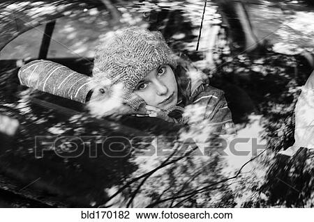 Caucasian teenage girl sitting in car View Large Photo Image Stock Image - Caucasian teenage girl sitting in car. Fotosearch
