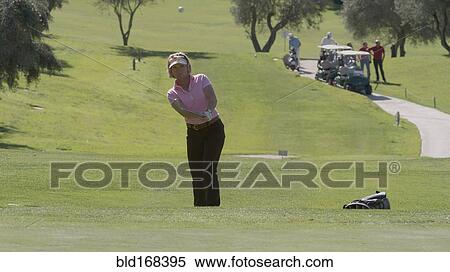 Caucasian woman playing golf on course View Large Photo Image Stock Photography - Caucasian woman playing golf on course. Fotosearch