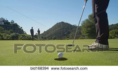 Caucasian woman putting on golf course View Large Photo Image Picture - Caucasian woman putting on golf course. Fotosearch