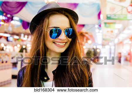 Caucasian woman smiling in shopping mall View Large Photo Image Picture - Caucasian woman smiling in shopping mall. Fotosearch