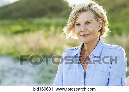 Caucasian woman smiling on beach View Large Photo Image Stock Image - Caucasian woman smiling on beach. Fotosearch