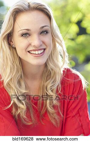 Stock Photo - Caucasian woman smiling outdoors. Fotosearch