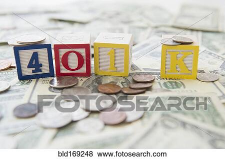Stock Photo - Close up of 401K toy blocks and money. Fotosearch
