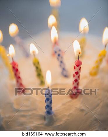 Close up of birthday candles in cake View Large Photo Image Picture - Close up of birthday candles in cake. Fotosearch