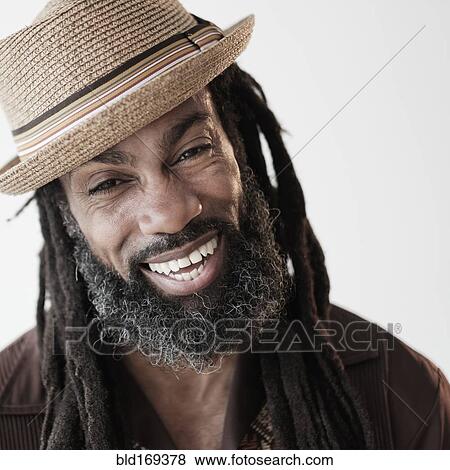 Stock Photo - Close up of Black man with dreadlocks laughing. Fotosearch