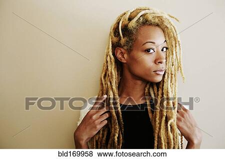 Stock Photo - Close up of Black woman with dreadlocks. Fotosearch