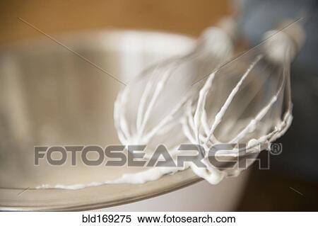 Close up of electric mixer whipping cream View Large Photo Image Stock Photography - Close up of electric mixer whipping cream. Fotosearch