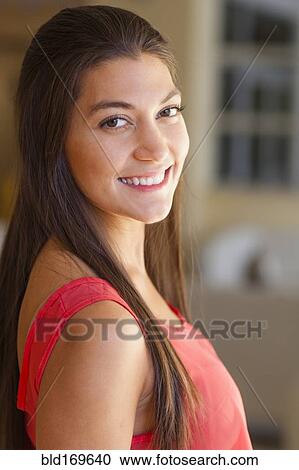 Stock Image - Close up of Hispanic woman smiling. Fotosearch