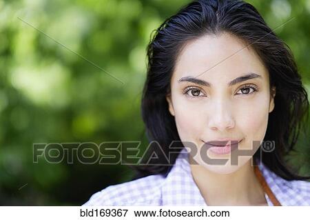 Close up of Hispanic woman smiling outdoors View Large Photo Image Stock Photo - Close up of Hispanic woman smiling outdoors. Fotosearch