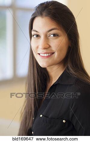 Close up of Hispanic woman smiling View Large Photo Image Stock Photo - Close up of Hispanic woman smiling. Fotosearch