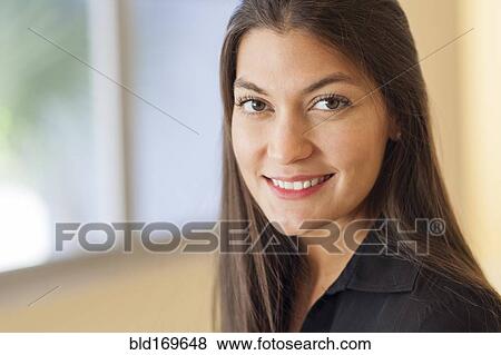 Stock Photo - Close up of Hispanic woman smiling. Fotosearch
