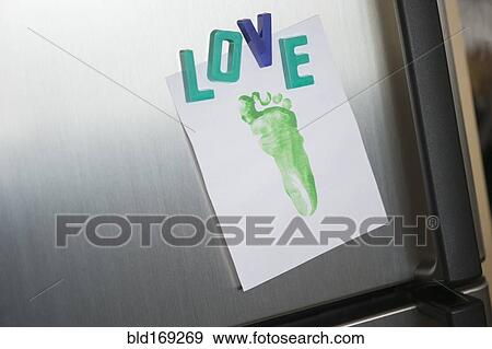 Close up of love magnets and footprint on refrigerator View Large Photo Image Stock Photo - Close up of love magnets and footprint on refrigerator. Fotosearch