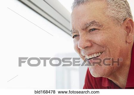 Close up of older Black man smiling View Large Photo Image Stock Photo - Close up of older Black man smiling. Fotosearch