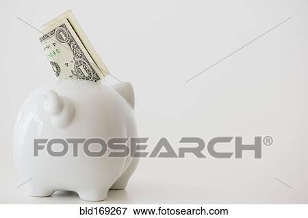 Stock Photo - Close up of piggy bank with money. Fotosearch