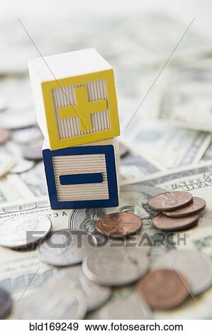 Close up of plus and minus toy blocks with money View Large Photo Image Stock Photo - Close up of plus and minus toy blocks with money. Fotosearch