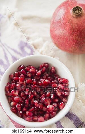 Picture - Close up of pomegranate and seeds. Fotosearch