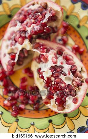 Stock Photograph - Close up of pomegranate and seeds. Fotosearch