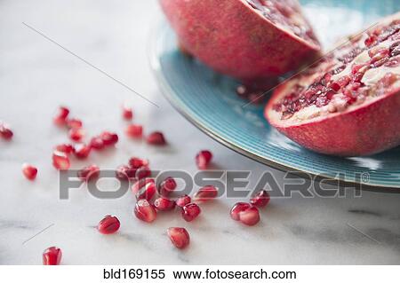 Stock Photography - Close up of pomegranate and seeds. Fotosearch