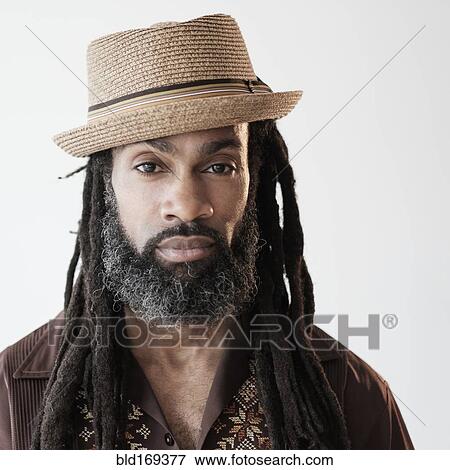 Stock Photo - Close up of serious Black man with dreadlocks. Fotosearch