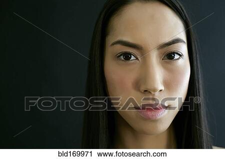Close up of serious mixed race woman View Large Photo Image Stock Image - Close up of serious mixed race woman. Fotosearch