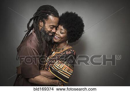 Close up of smiling couple hugging View Large Photo Image Picture - Close up of smiling couple hugging . Fotosearch