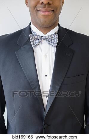Close up of smiling groom wearing tuxedo View Large Photo Image Stock Photography - Close up of smiling groom wearing tuxedo. Fotosearch